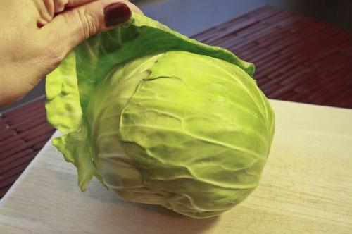 remove the top leaves of the cabbage